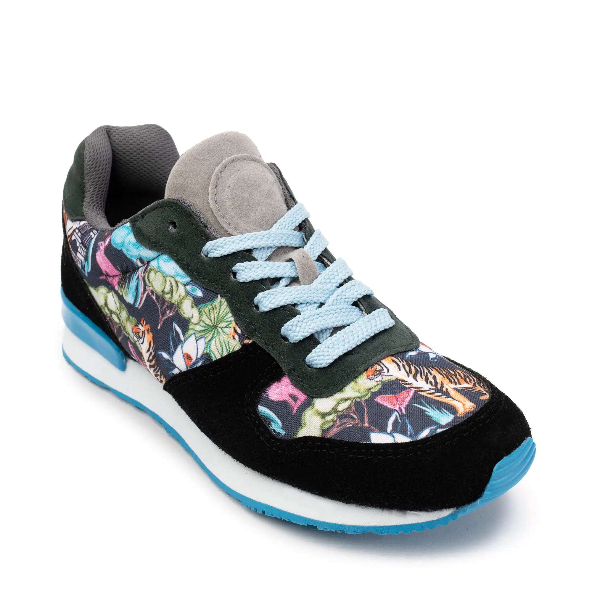 A low-top sneaker with a black suede toe and heel, a colorful tropical animal print side panel, light blue laces, and a white and blue sole, shown on a white background.