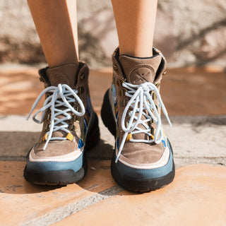 Close view of the Inkkas Alpine Trekk Boot worn outdoors
